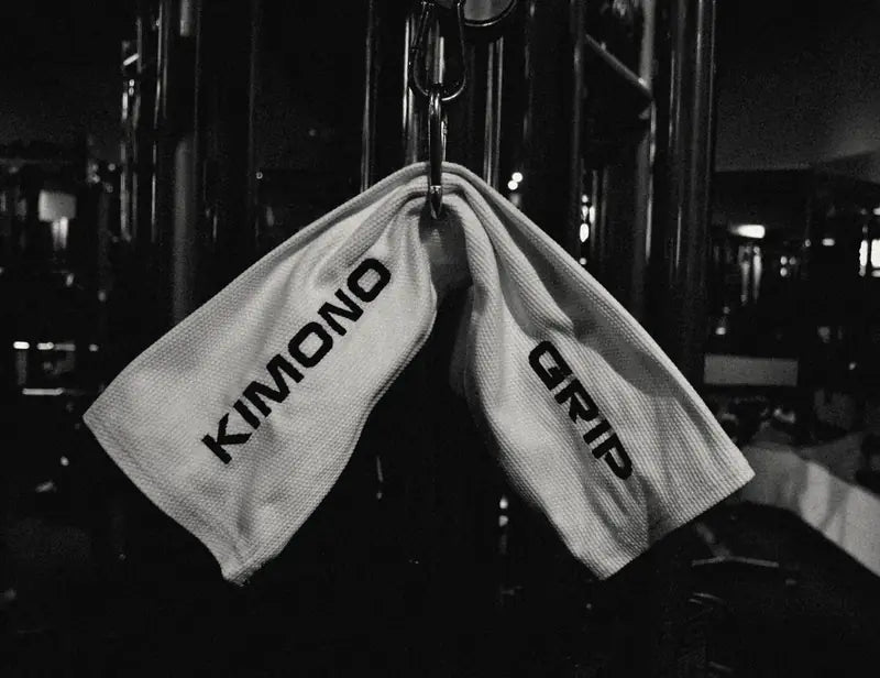 Kimono Grip hanging from a cable machine carabiner